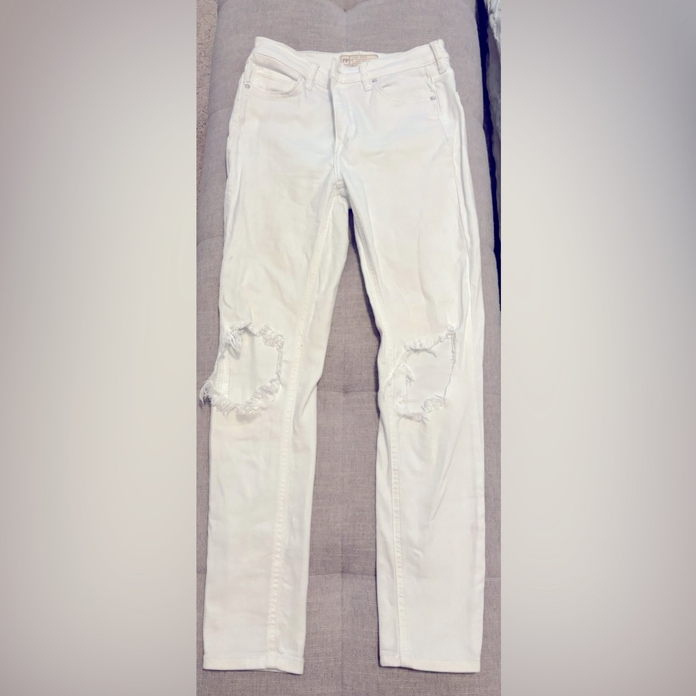 Free People distressed white jeans. Distressed holes at the knees. No stains